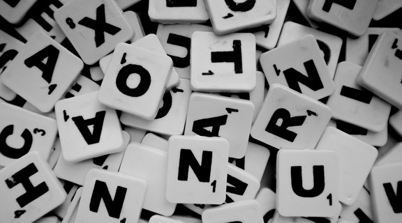 Homepage canva   pile of scrabble tiles with letters