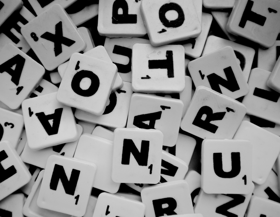 Large canva   pile of scrabble tiles with letters