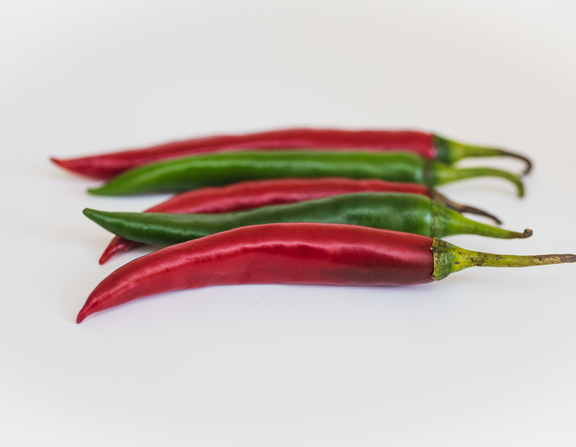 Large canva   two green and three red chili peppers