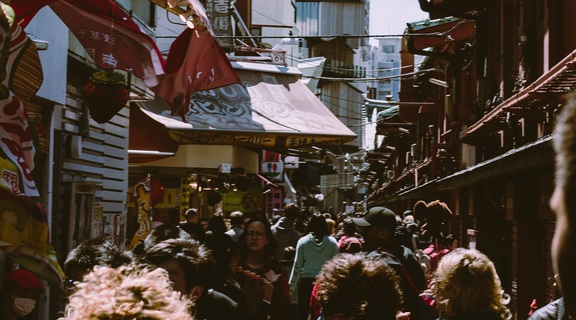 Homepage canva   urban photo of a crowd in a marketplace